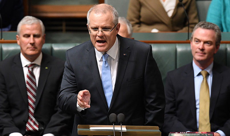 Federal Treasurer Scott Morrison hands down his third Federal Budget in the House of Representatives at Parliament House in Canberra. (AAP Image/Dean Lewins)