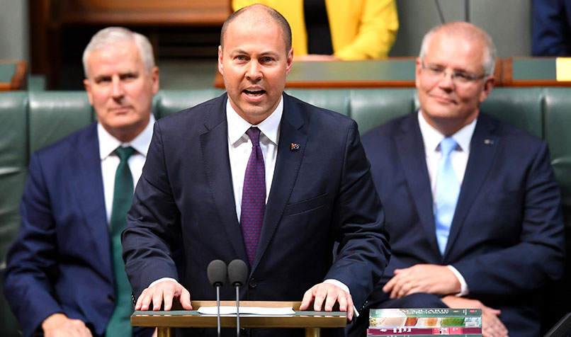 Treasurer Josh Frydenberg handing down his first Federal Budget in the House of Representatives at Parliament House in Canberra. (AAP Image/Lukas Coch)