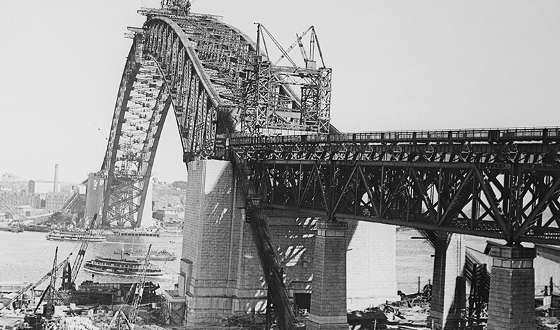 The latter stages of construction of the giant steel arch of the Sydney Harbour Bridge, circa 1930.