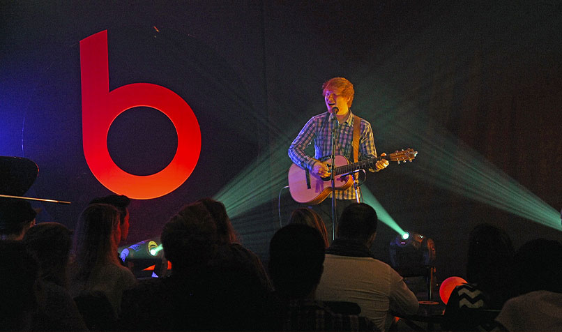Musician Ed Sheeran attends Beats Present: Sound Symposium in July 2014 in London. Beats Electronics was acquired by Apple in 2014, for a sum of US$3 billion (A$3.9 billion).