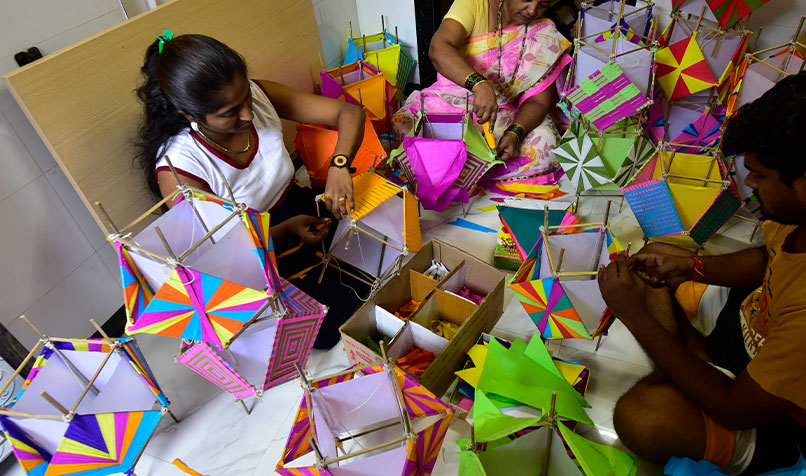 A family prepares “Aakash Kandil” – lanterns made of paper and cane – for the Diwali Festival in Mumbai, India, in October 2021.
