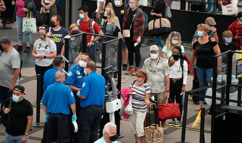 Travellers at security checkpoints in the main terminal of Denver International Airport in August 2021. The relative easing of travel and lockdown restrictions has driven a rise in international travel from the US.