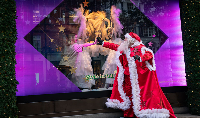 A man dressed as Santa Claus outside Selfridges in London as the department store unveils its Christmas windows on Oxford Street. This year’s display is themed around ‘Christmas of Dreams’. October 28, 2021.