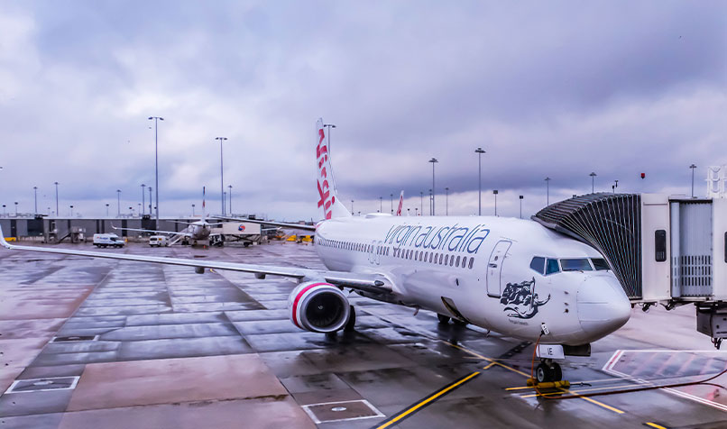 A Virgin Australia aircraft at the domestic terminal of the Melbourne Airport. Interstate travel in Australia remains largely restricted due to border closures.
